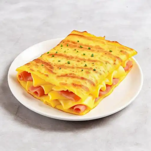 Tortilla de huevo con jamón y queso Tortilla de huevo con jamón y queso - Imagen 1